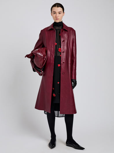 Proenza Schouler front image of model wearing Nissi Coat In Semigloss Leather in burgundy