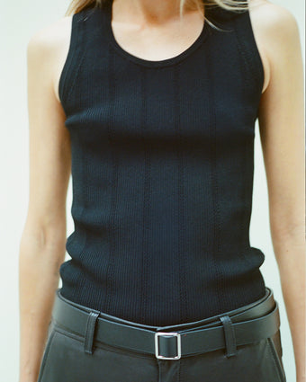 Cropped image of model wearing Perry Knit Top in Compact Pointelle Rib in black