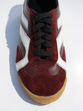 Cropped aerial image of Track Sneakers in oxblood