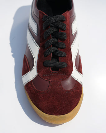 Cropped aerial image of Track Sneakers in oxblood