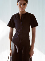 Cropped image of model wearing Elizabeth Dress in Parachute Cotton in black