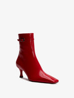 Proenza Schouler 3/4 front image of Trap Ankle Boots in VERMILLION