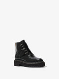 3/4 side image of Lug Sole Buckle Boots in BLACK