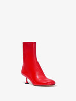 Proenza Schouler front 3/4 image of Tee Ankle Boots in RED