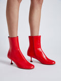 Proenza Schouler cropped image of model wearing Tee Ankle Boots in RED