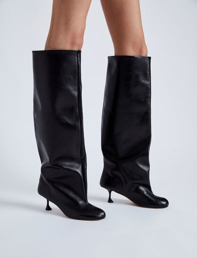 Image of model wearing TEE KNEE HIGH BOOTS in BLACK