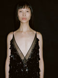 Cropped image of model, wearing Irene Dress in Resin Embroidered Organza in black.