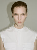 Cropped image of a model wearing Erica Dress in Organic Cotton Twill in off white.