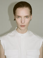 Cropped image of a model wearing Erica Dress in Organic Cotton Twill in off white.