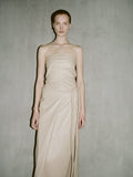 Cropped image of a model wearing Delancy Dress in Glossy Leather in nude.