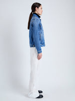 Side image of model wearing Newman Jacket in medium blue