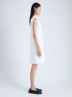 Side full length image of model wearing Erica Dress in Organic Cotton Twill Suiting in OFF WHITE