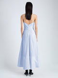 Back image of model wearing Ruby Dress in Eco Stretch Linen Viscose in sky blue