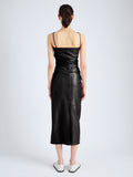 Back image of model wearing Delancy Dress in Glossy Leather in black