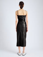 Back image of model wearing Delancy Dress in Glossy Leather in black