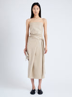 Front image of model wearing Delancy Dress in Glossy Leather in NUDE