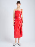 Front image of model wearing Delancy Dress in Glossy Leather in VERMILLION