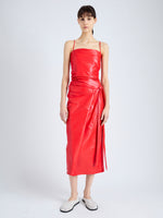 Front image of model wearing Delancy Dress in Glossy Leather in VERMILLION