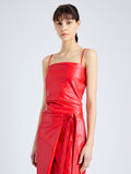 Detail image of model wearing Delancy Dress in Glossy Leather in VERMILLION