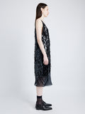 Side image of model wearing Irene Dress in Resin Embroidered Organza in BLACK