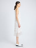 Side image of model wearing Irene Dress in Resin Embroidered Organza in white