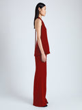 Side image of model wearing Miller Top in Light Matte Viscose Crepe in red