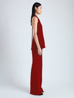 Side image of model wearing Miller Top in Light Matte Viscose Crepe in red