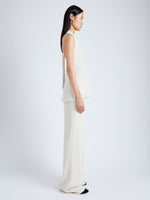 Side full length image of model wearing Miller Top in Light Matte Viscose Crepe in WHEAT