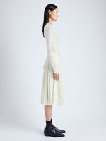 Side image of model wearing Margo Skirt in Gauzy Jersey in BONE