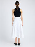 Back image of model wearing Moore Skirt in Organic Cotton Twill in off white