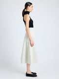 Side image of model wearing Moore Skirt in Organic Cotton Twill in wheat\