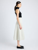 Side image of model wearing Moore Skirt in Organic Cotton Twill in wheat\