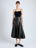 Front image of model wearing Moore Skirt in Glossy Leather in BLACK