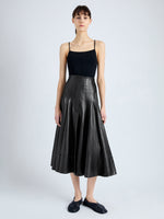 Front image of model wearing Moore Skirt in Glossy Leather in BLACK