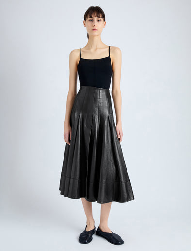 Front image of model wearing Moore Skirt in Glossy Leather in BLACK