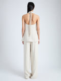 Back full length image of model wearing Weyes Pant In Light Matte Viscose Crepe in WHEAT