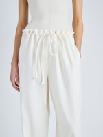 Detail image of model wearing Jade Pant in Eco Stretch Linen Viscose in PEARL