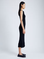 Side full length image of model wearing Tatum Knit Dress in Silk Viscose in BLACK