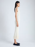 Side image of model wearing Tatum Knit Dress in Silk Viscose in IVORY