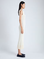 Side image of model wearing Tatum Knit Dress in Silk Viscose in IVORY