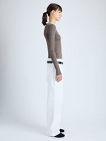 Side image of model wearing Cassidy Sweater in Superfine Merino Silk in taupe