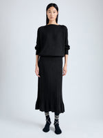 Front image of model wearing Eden Knit Dress in Superfine Merino Silk in black