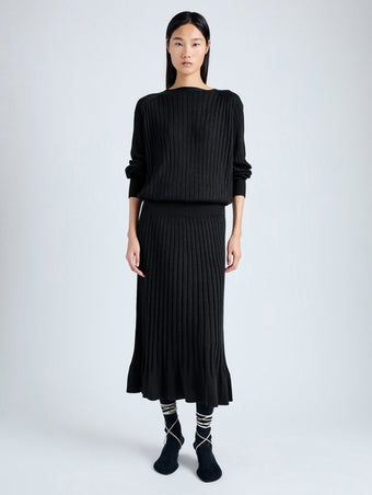 Front image of model wearing Eden Knit Dress in Superfine Merino Silk in black