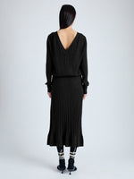 Back image of model wearing Eden Knit Dress in Superfine Merino Silk in black