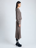 Side image of model wearing Eden Knit Dress in Superfine Merino Silk in taupe