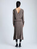 Back image of model wearing Eden Knit Dress in Superfine Merino Silk in taupe