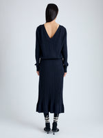 Back full length image of model wearing Eden Knit Dress in Superfine Merino Silk in NAVY