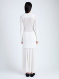 Back full length image of model wearing Anita Knit Dress in Sheer Mesh in OFF WHITE