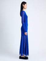 Side image of model wearing Anita Knit Dress in Sheer Mesh in Bright Blue