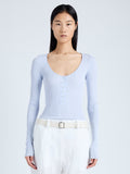 Cropped front image of model wearing Boyd Henley in Silk Viscose in sky blue